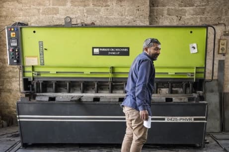CNC bending support machine and operator inside Jay Safe factory